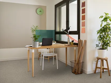 Light Gray Carpet Flooring in Modern Home Office Setting Modern home office with light gray carpet flooring, wooden desk, and potted plants