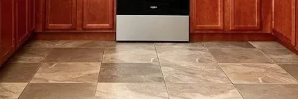 Stone Look Luxury Vinyl Tile Flooring in Modern Kitchen Scene Modern kitchen with stone look luxury vinyl tile flooring in shades of beige and brown