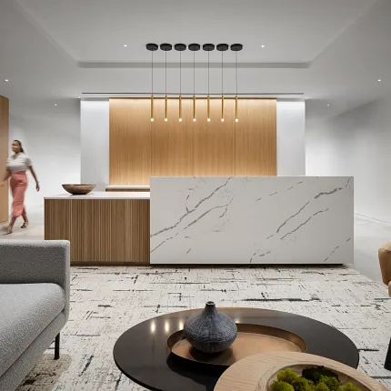 Contemporary Workplace Design with Marble and Wood Elements Modern workplace interior with a marble reception desk, wooden paneling, and contemporary furniture