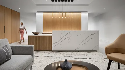 Contemporary Workplace Design with Marble and Wood Elements Modern workplace interior with a marble reception desk, wooden paneling, and contemporary furniture