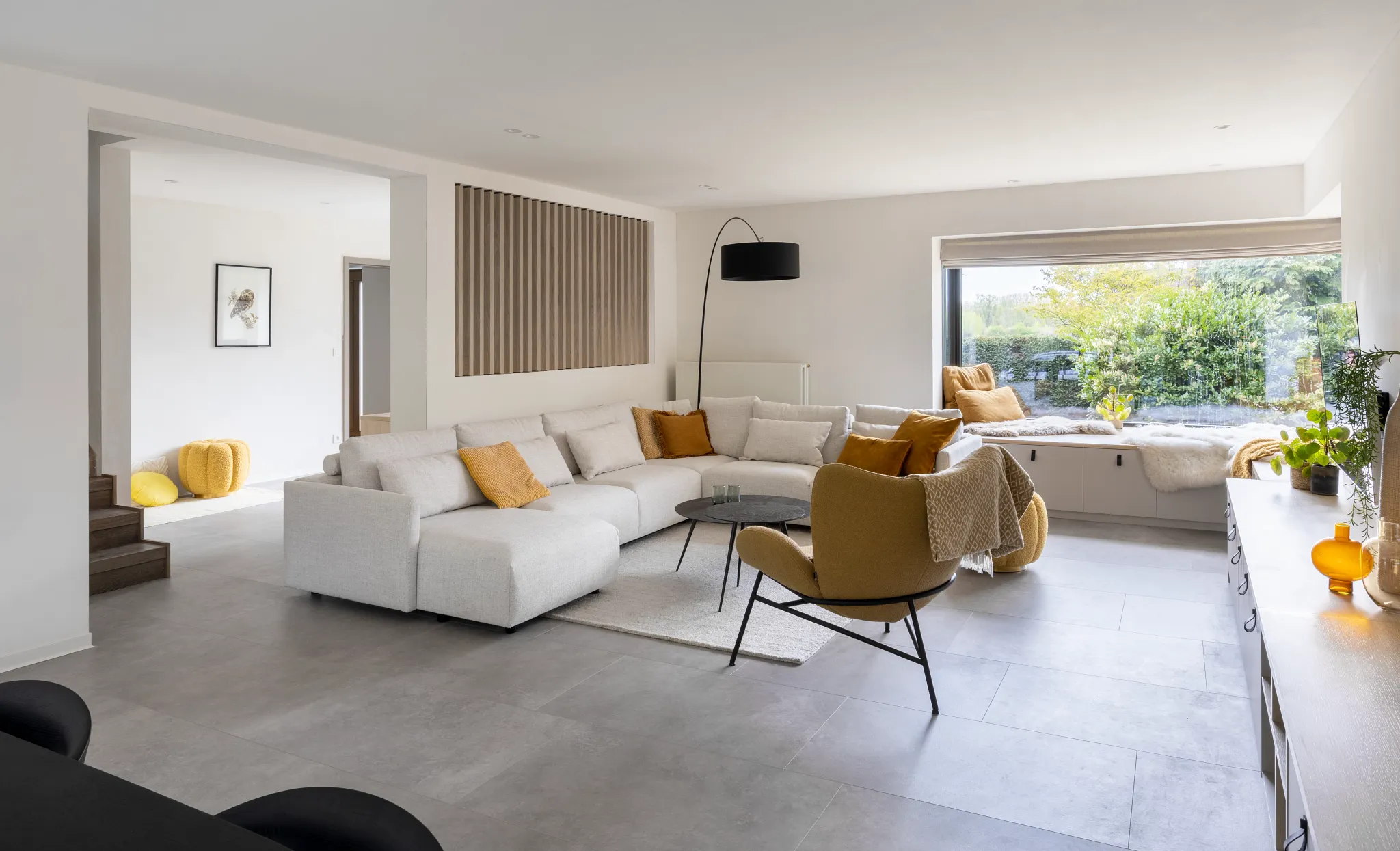 Modern living room with yellow decoration and concrete Coretec tile
