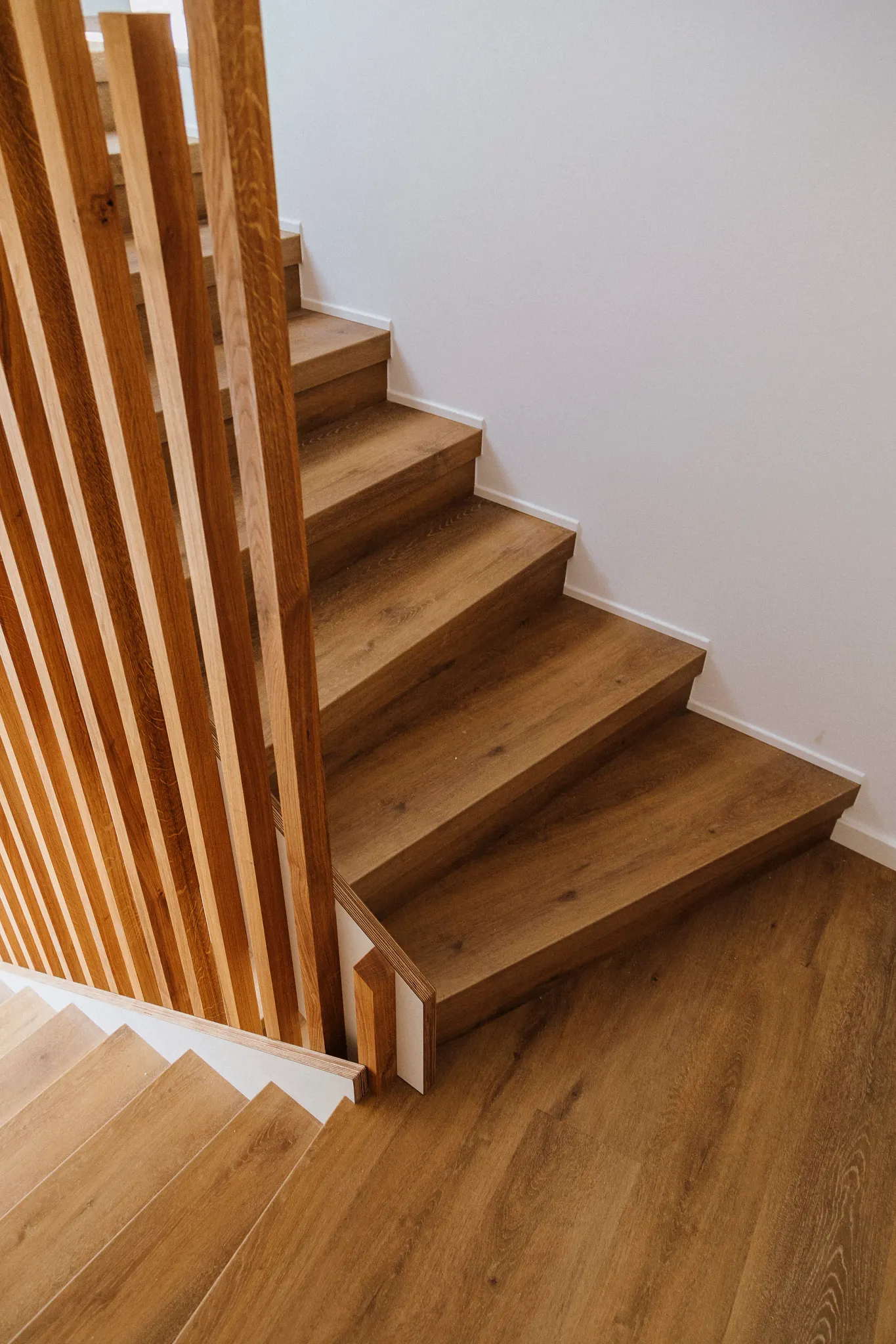 Wooden brown stairs with Coretec Multilayer Floors