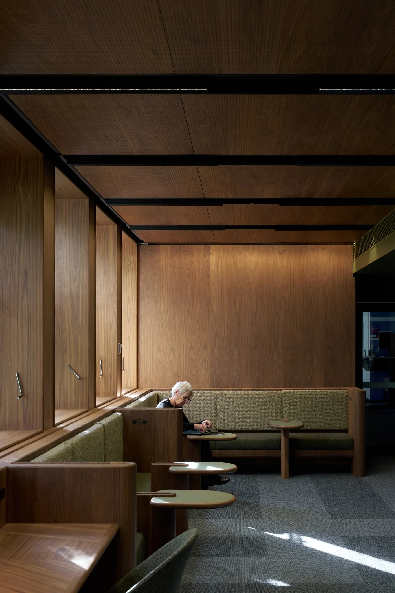 Study and collaboration area within the Monash University Clayton Menzies Building Level 1 Teaching Space Upgrades project by Hayball, featuring timber finishes, integrated booth seating and flexible learning spaces.