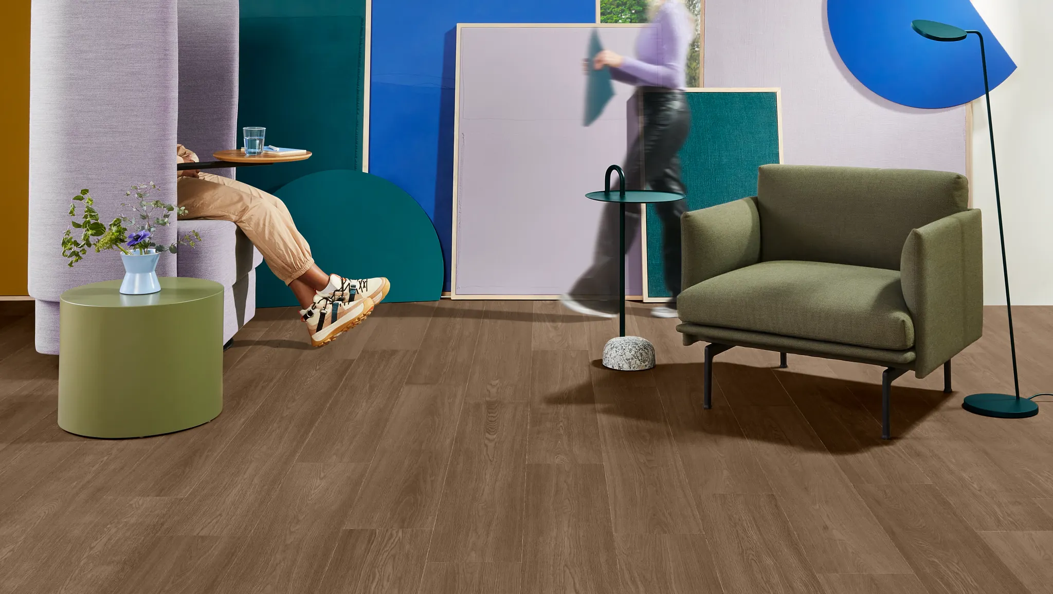 Modern workplace with PVC-Free EcoWorx Resilient flooring in a contemporary setting featuring colorful panels and furniture