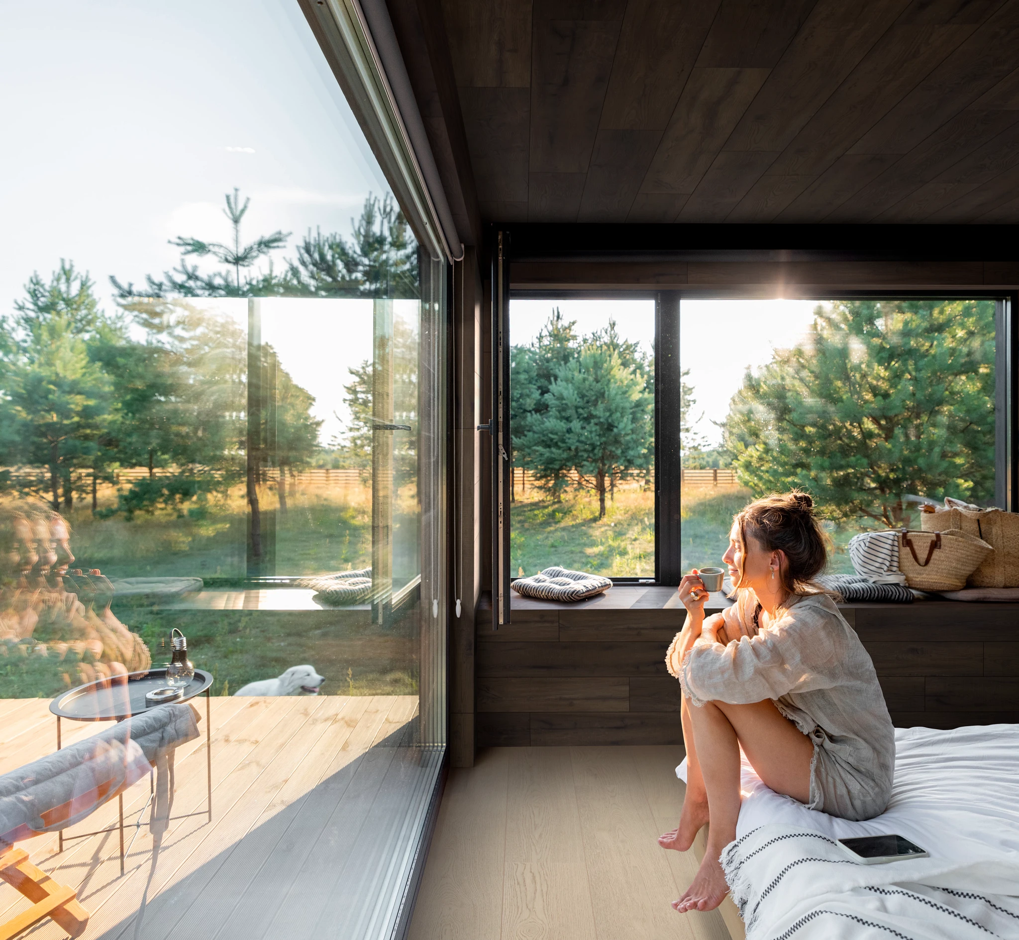 Modern living room with large windows and luxury vinyl plank flooring