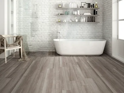 Contemporary Bathroom with Light Brown Wood-Look Flooring Modern bathroom with white brick walls, freestanding bathtub, and light brown wood-look flooring