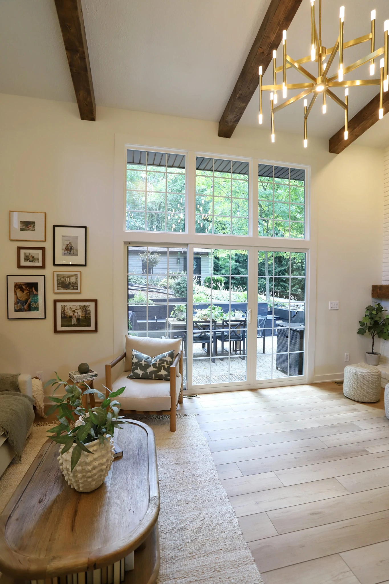Modern living room with large windows and wood look luxury vinyl plank flooring