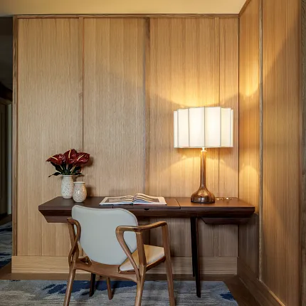 Stylish workspace with warm wood tones and artistic carpet design Cozy study area with wooden paneling and patterned carpet