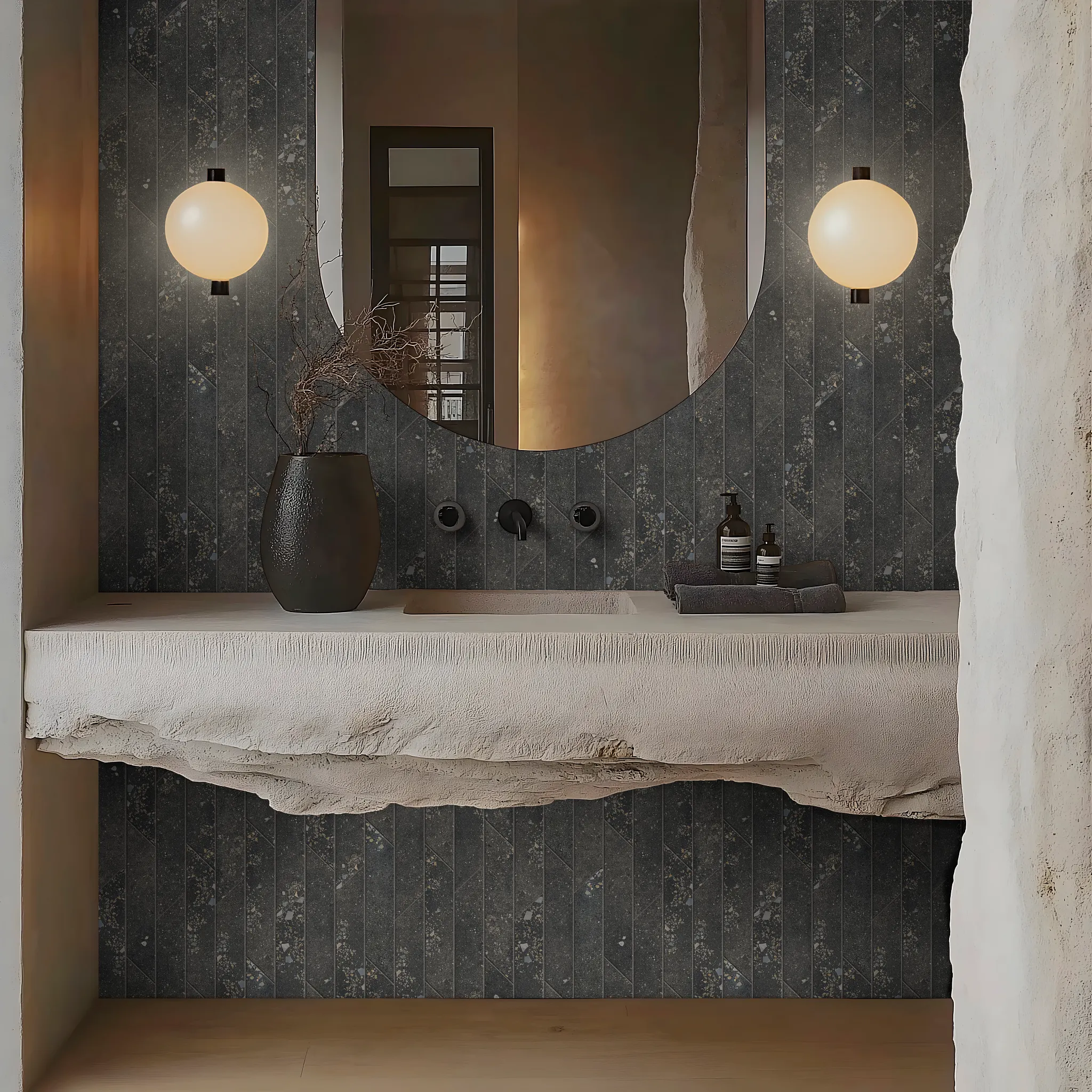 Modern bathroom with dark porcelain tile wall and rustic stone sink