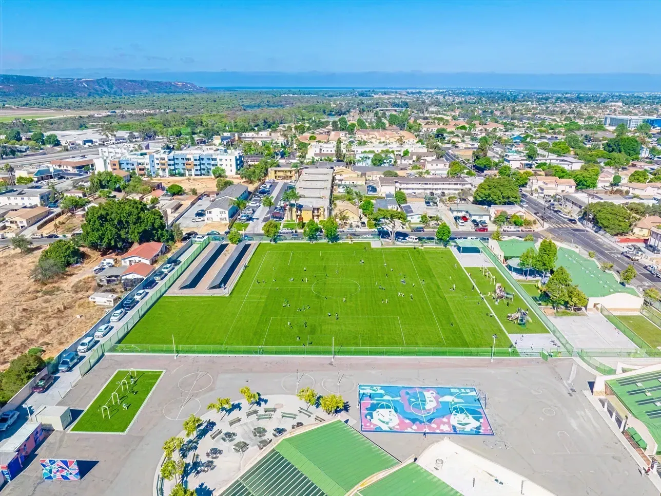 Aerial view of a sports field and surrounding area