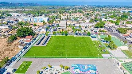 Scenic aerial landscape of sports facilities and community Aerial view of a sports field and surrounding area