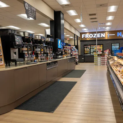 Durable Rigid Core flooring with 47.55x5.66 inch dimensions Rigid Core flooring in a grocery store setting
