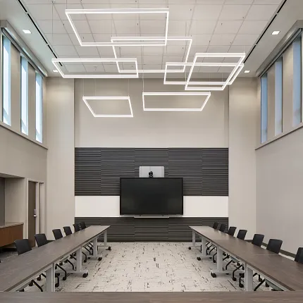 Contemporary office design with stylish flooring and lighting Modern conference room with sleek lighting and neutral flooring