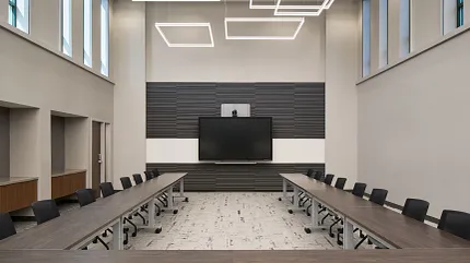 Contemporary office design with stylish flooring and lighting Modern conference room with sleek lighting and neutral flooring