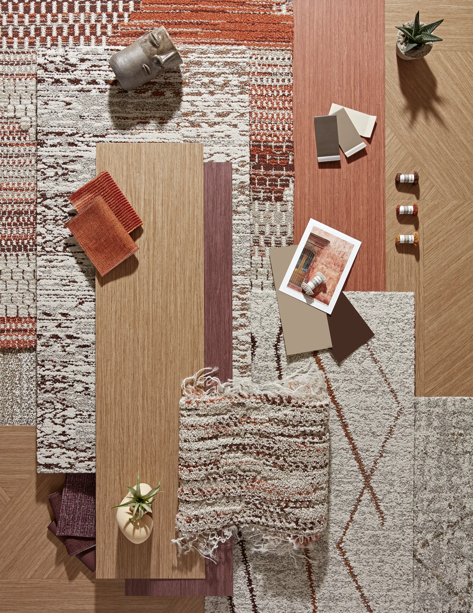 Assorted carpet and flooring samples in earthy tones