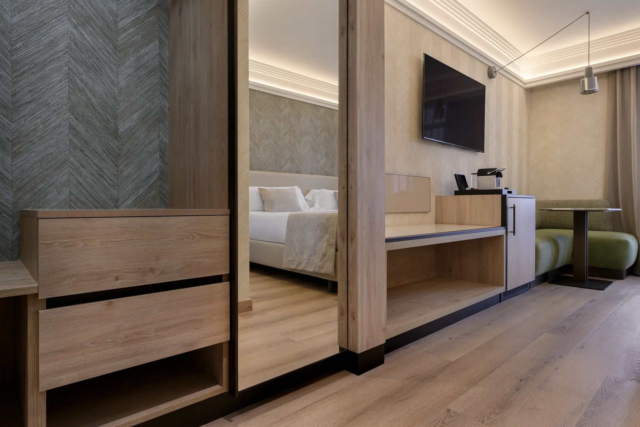 Hotel closet with mirror and wooden Coretec floor