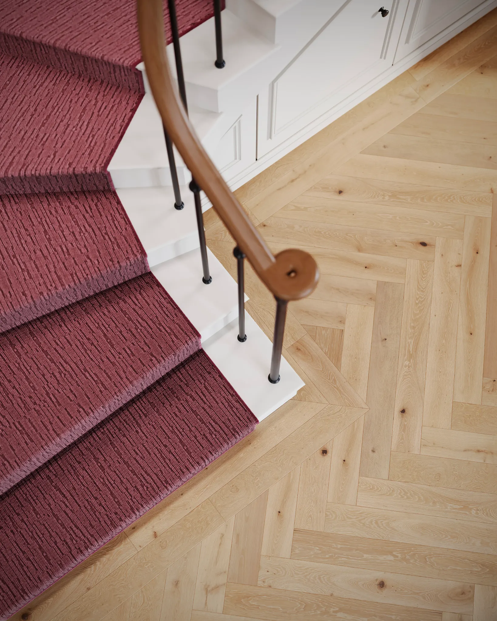 Modern living room with beige armchair and textured carpet flooring
