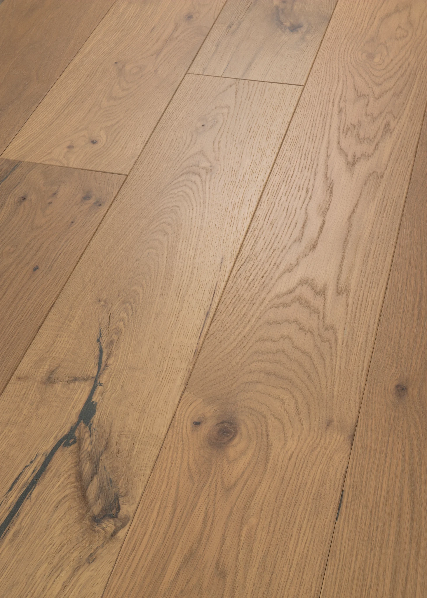 Natural oak wood flooring with visible grain patterns and knots