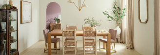 dining room in muted pink tones featuring a coretec luxury vinyl floor