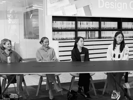 Contemporary Office Meeting Room with Modern Design Elements Modern workplace meeting room with a group of people seated around a table, featuring contemporary office furniture and flooring