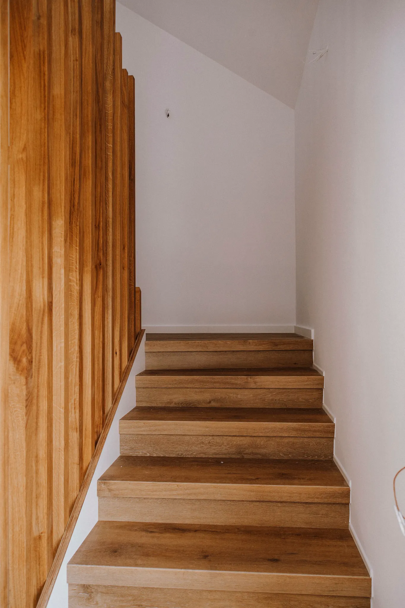 Wooden brown stairs with Coretec Multilayer Floors
