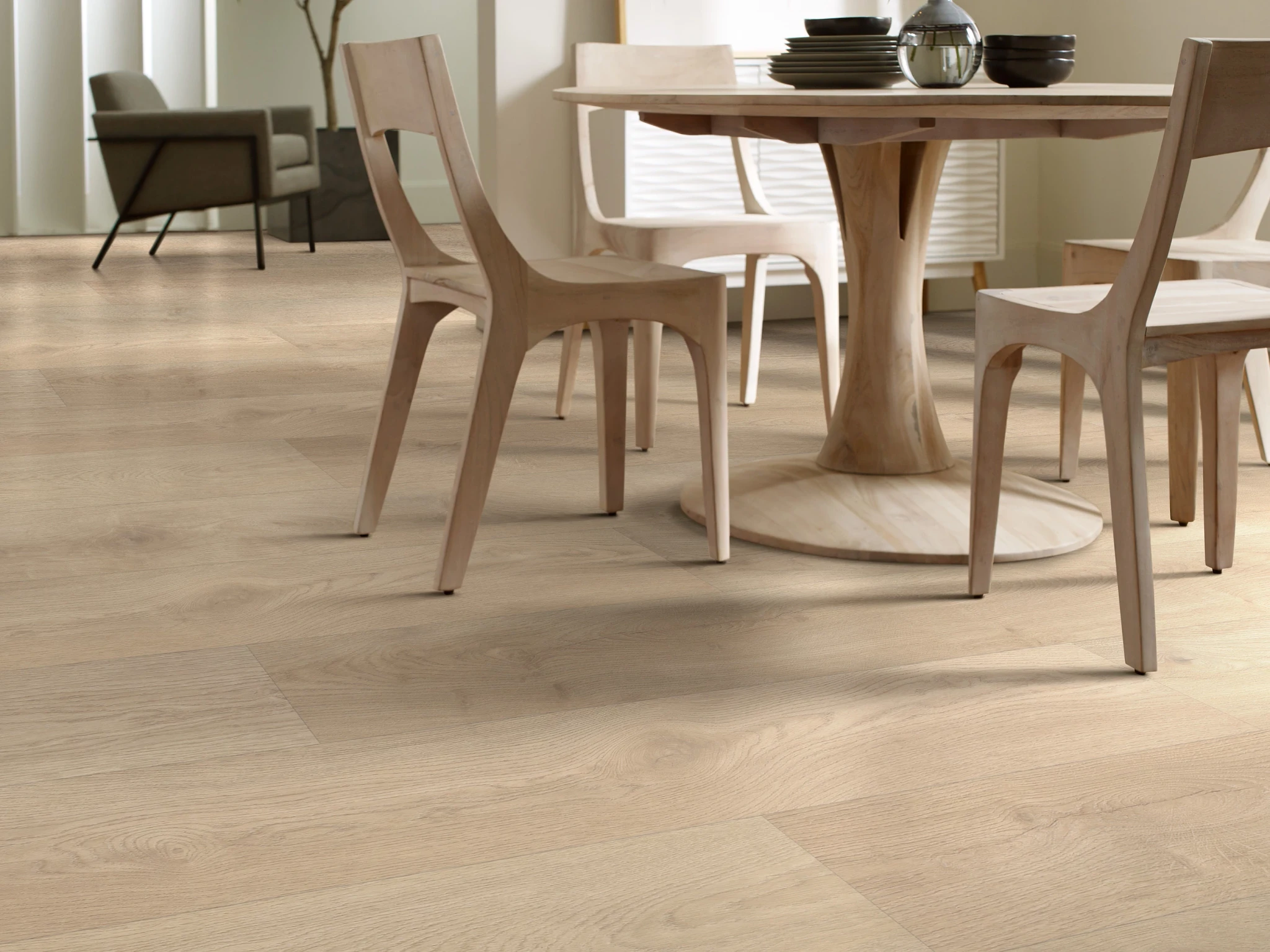 Light wood look vinyl flooring in a modern dining room with WPC construction
