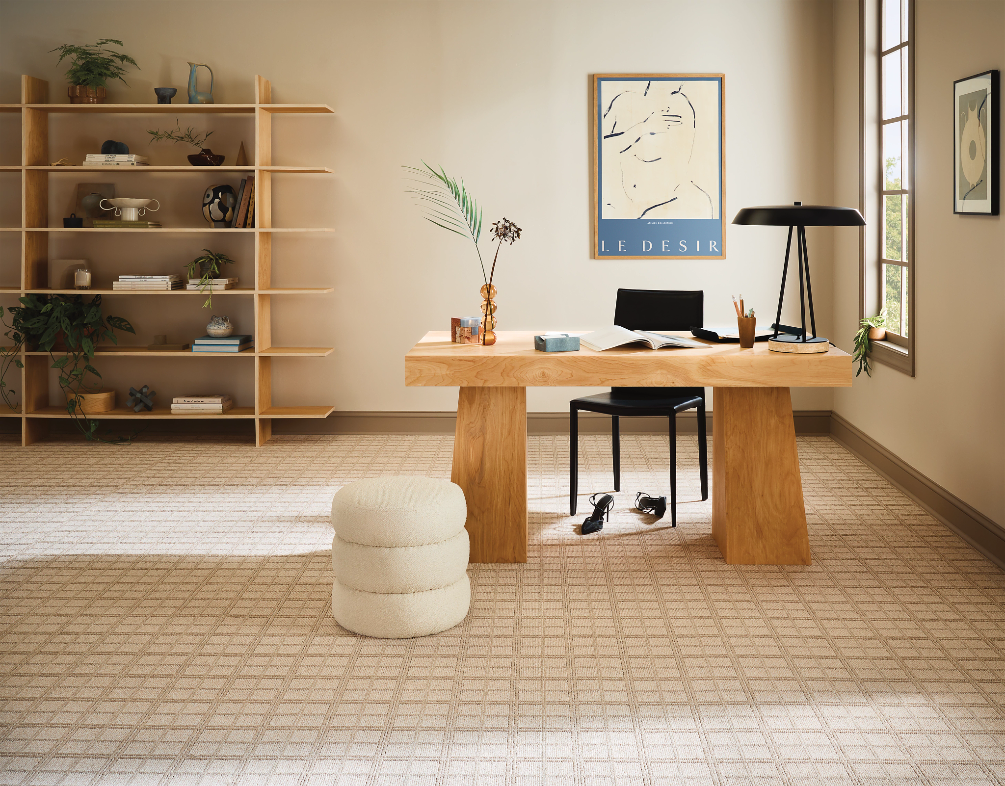 Office with a wooden desk and brooadloom carpet
