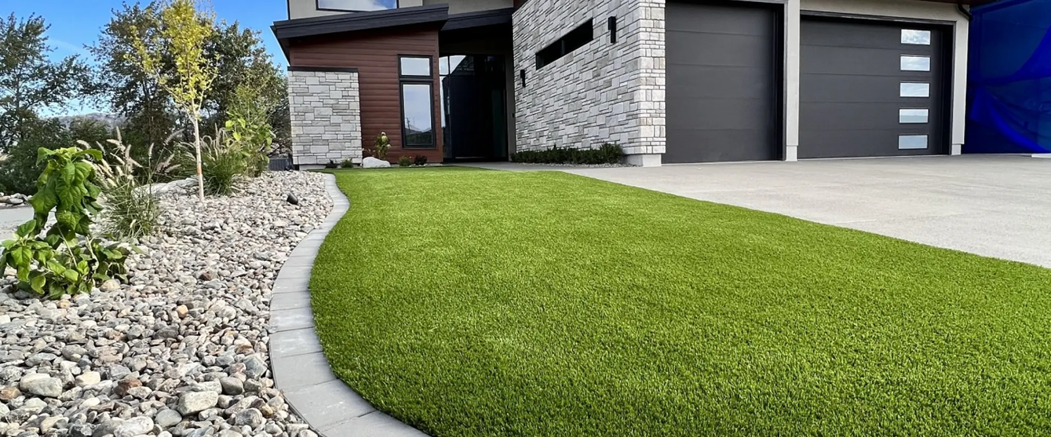 Modern home exterior with artificial grass lawn