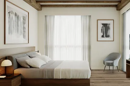 Hospitality room with elegant hardwood flooring and contemporary design Modern hotel room with wooden beams, neutral decor, and hardwood flooring