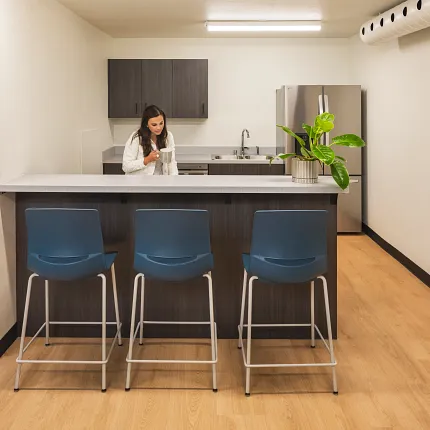 Education Facility Kitchen with EcoWorx Resilient Flooring Modern kitchen area in an education facility with heavy commercial PVC-free EcoWorx resilient flooring, featuring a light wood finish and dimensions of 50.79x8.27 inches
