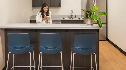 Education Facility Kitchen with EcoWorx Resilient Flooring Modern kitchen area in an education facility with heavy commercial PVC-free EcoWorx resilient flooring, featuring a light wood finish and dimensions of 50.79x8.27 inches