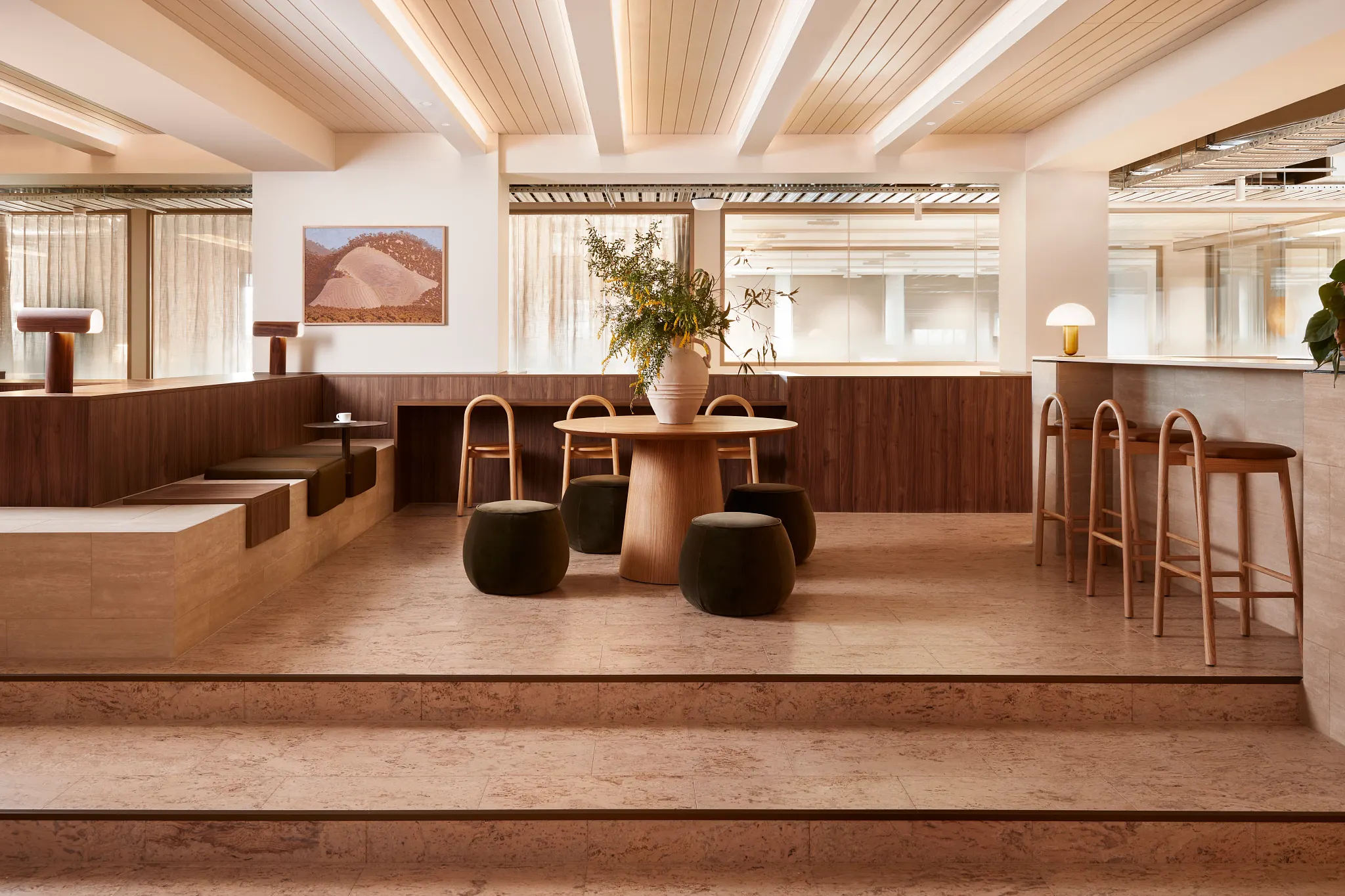 Modern office space with cork flooring and wooden furniture