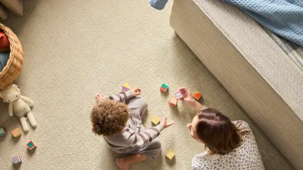Comfortable and durable beige carpet for family living spaces Cozy family room with children playing on soft beige carpet