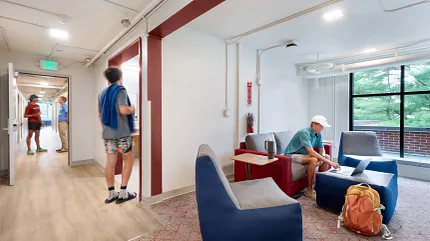 Education Facility Lounge with Modern Seating and Light Wood Flooring