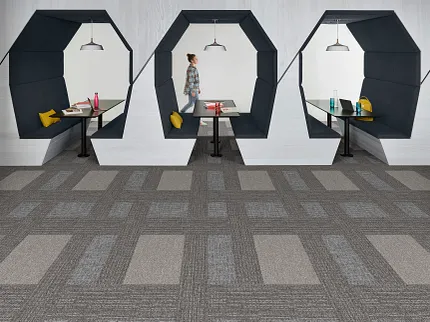 Education Facility with Geometric Seating and Gray Commercial Carpet Tile Flooring Modern education facility with geometric seating and commercial carpet tile flooring in shades of gray