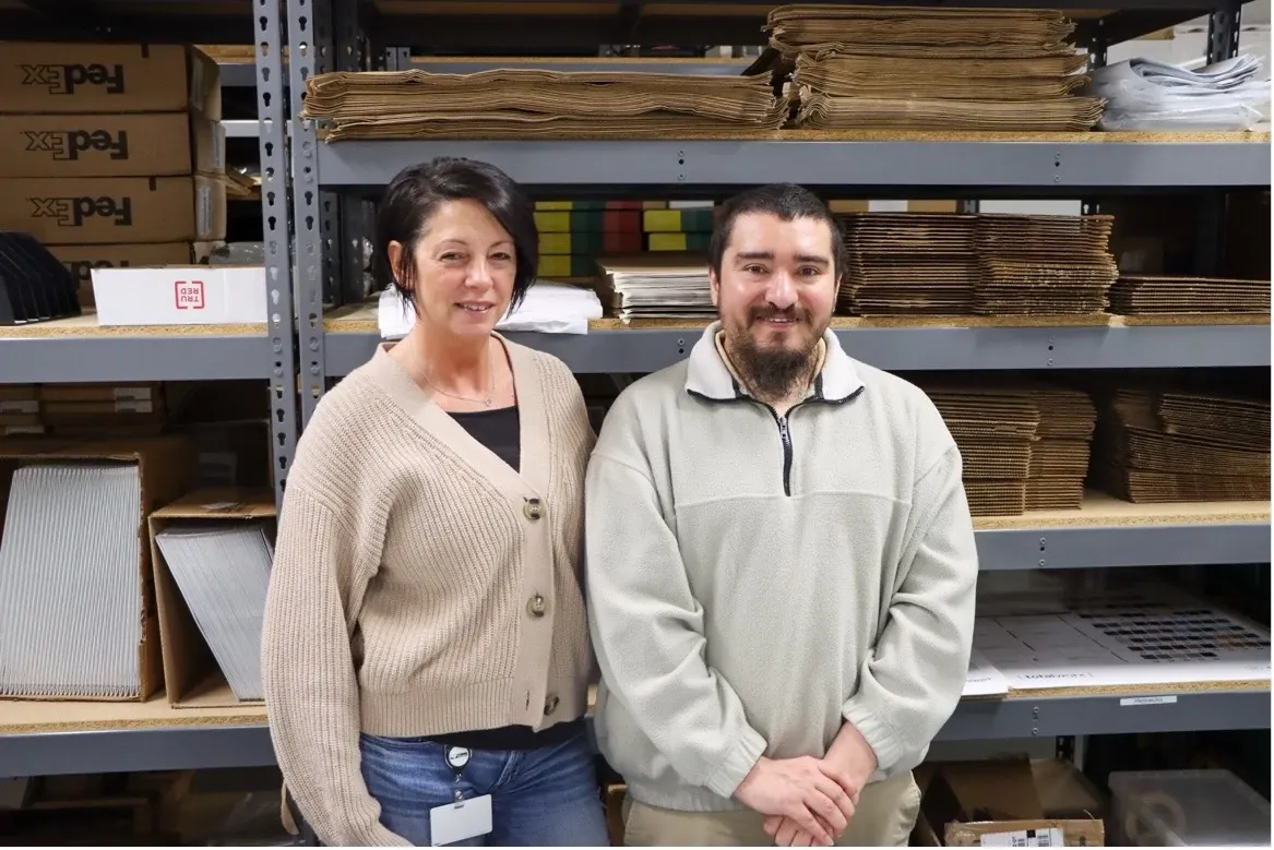 Warehouse storage with stacked cardboard boxes and shelving
