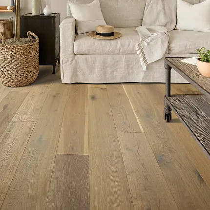 Rustic Wood Flooring in Cozy Living Room Scene Cozy living room with light beige sofa and rustic wood flooring