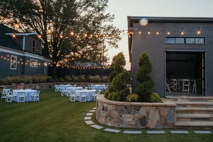 Charming garden venue for gatherings Outdoor event space with string lights and seating