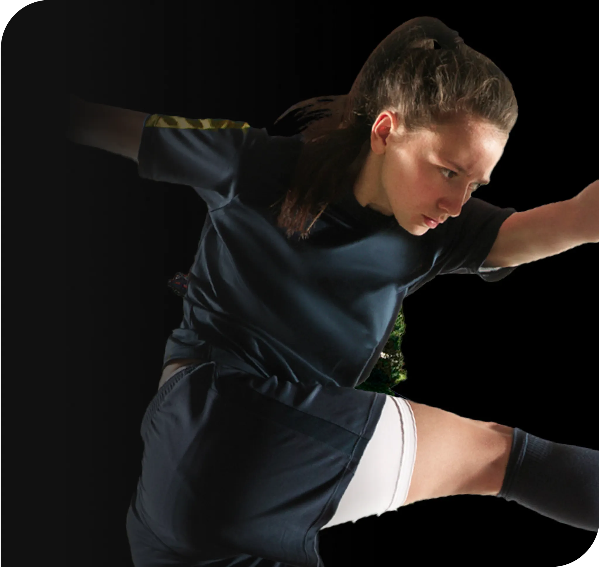 Young athlete in action wearing a dark sports uniform