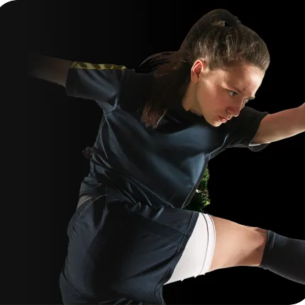 Young athlete in dark sports uniform Young athlete in action wearing a dark sports uniform