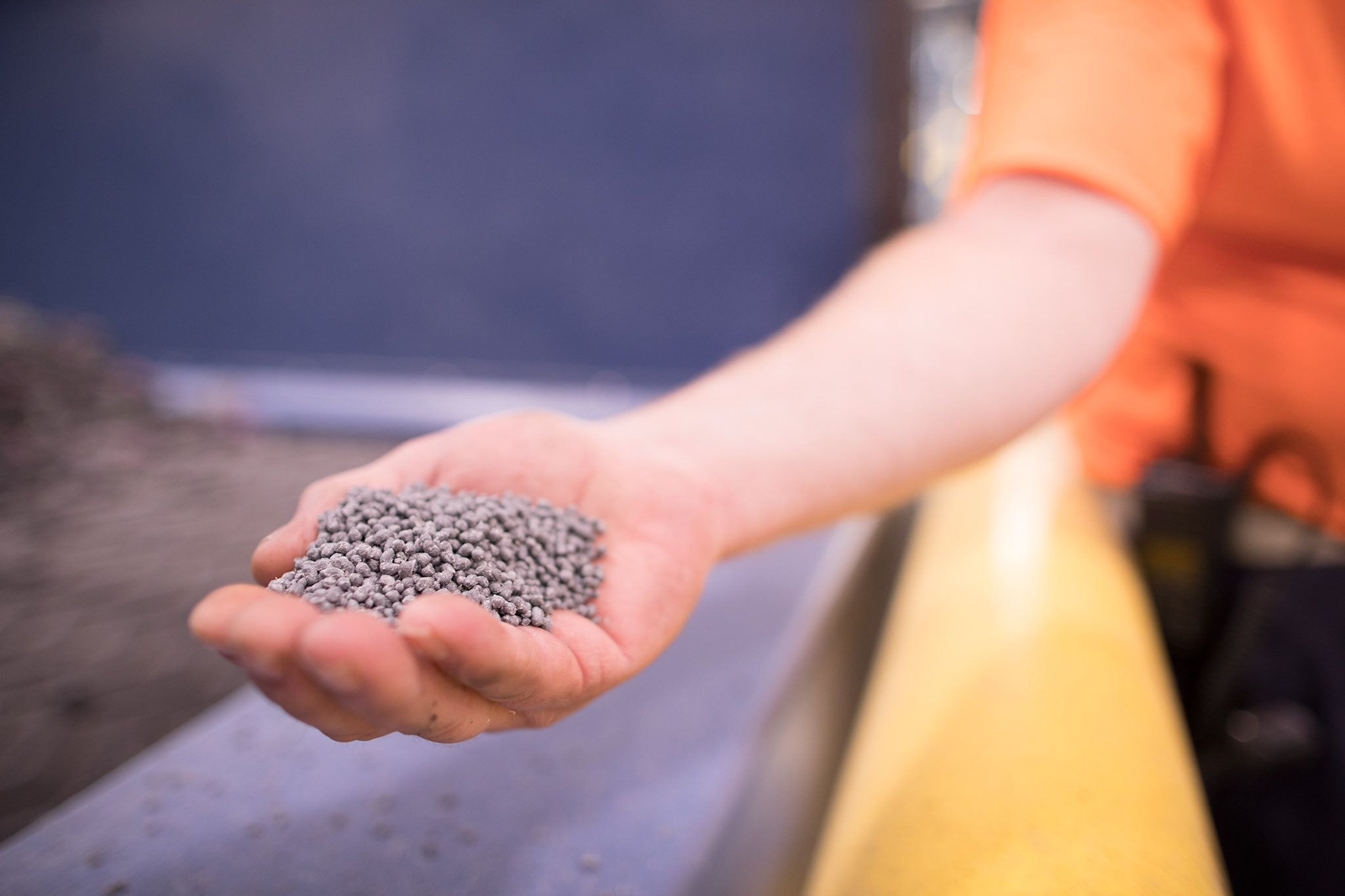 Hand holding recycled materials