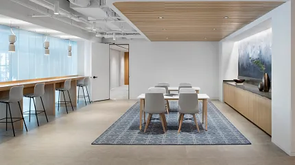 Contemporary Workplace Design with Geometric Area Rug Modern workplace with a 12x15 ft area rug featuring a geometric pattern