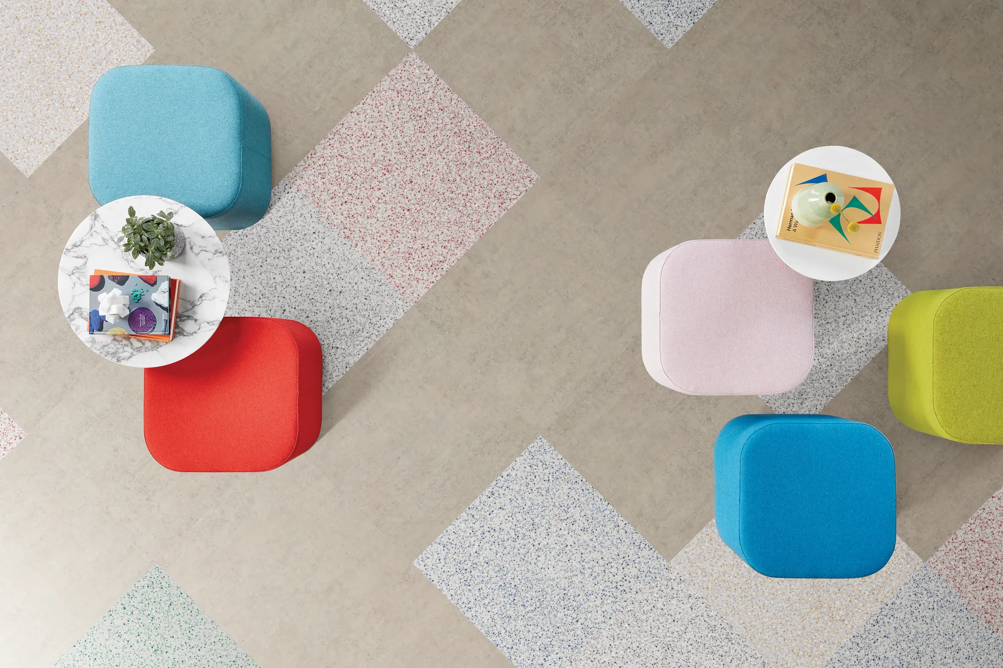Heavy commercial luxury vinyl tile flooring in assorted colors with modern seating