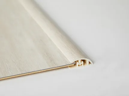 Light Wood Flooring Transition Strip Light wood-colored flooring transition strip on white background