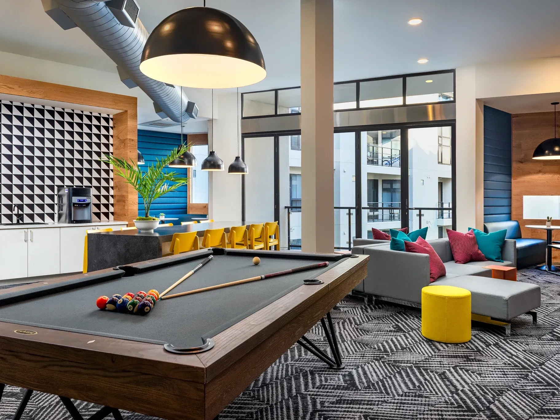 Modern game room with geometric patterned carpet flooring