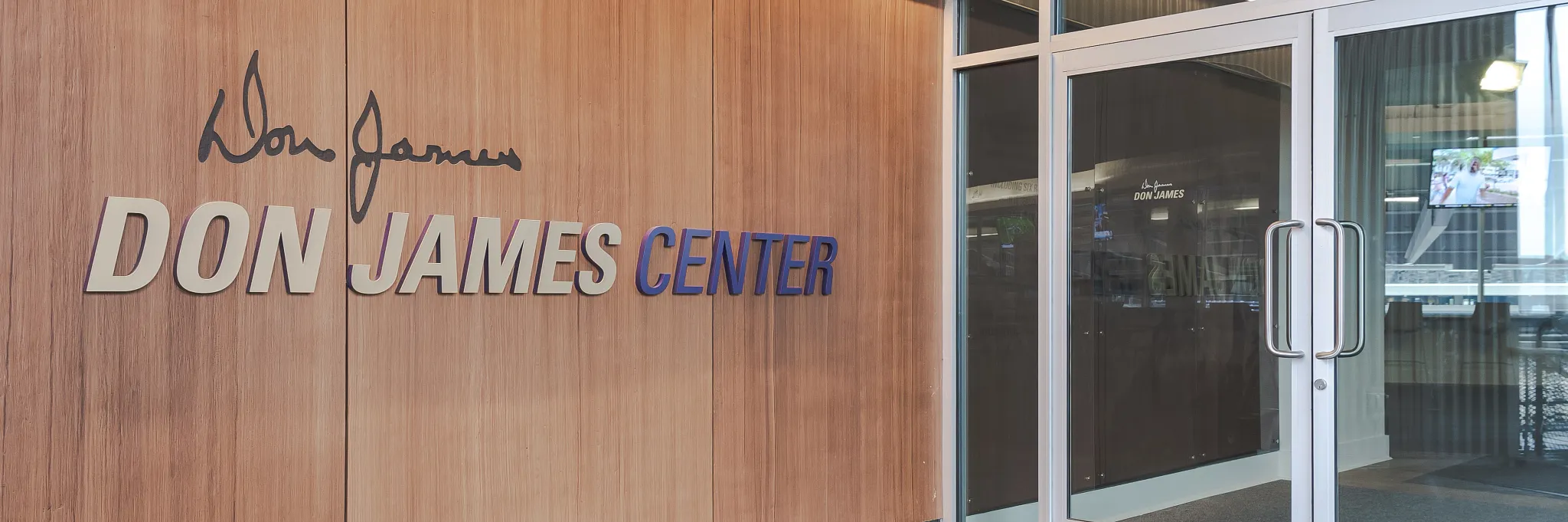 Entrance of Don James Center with commercial carpet flooring in an education facility