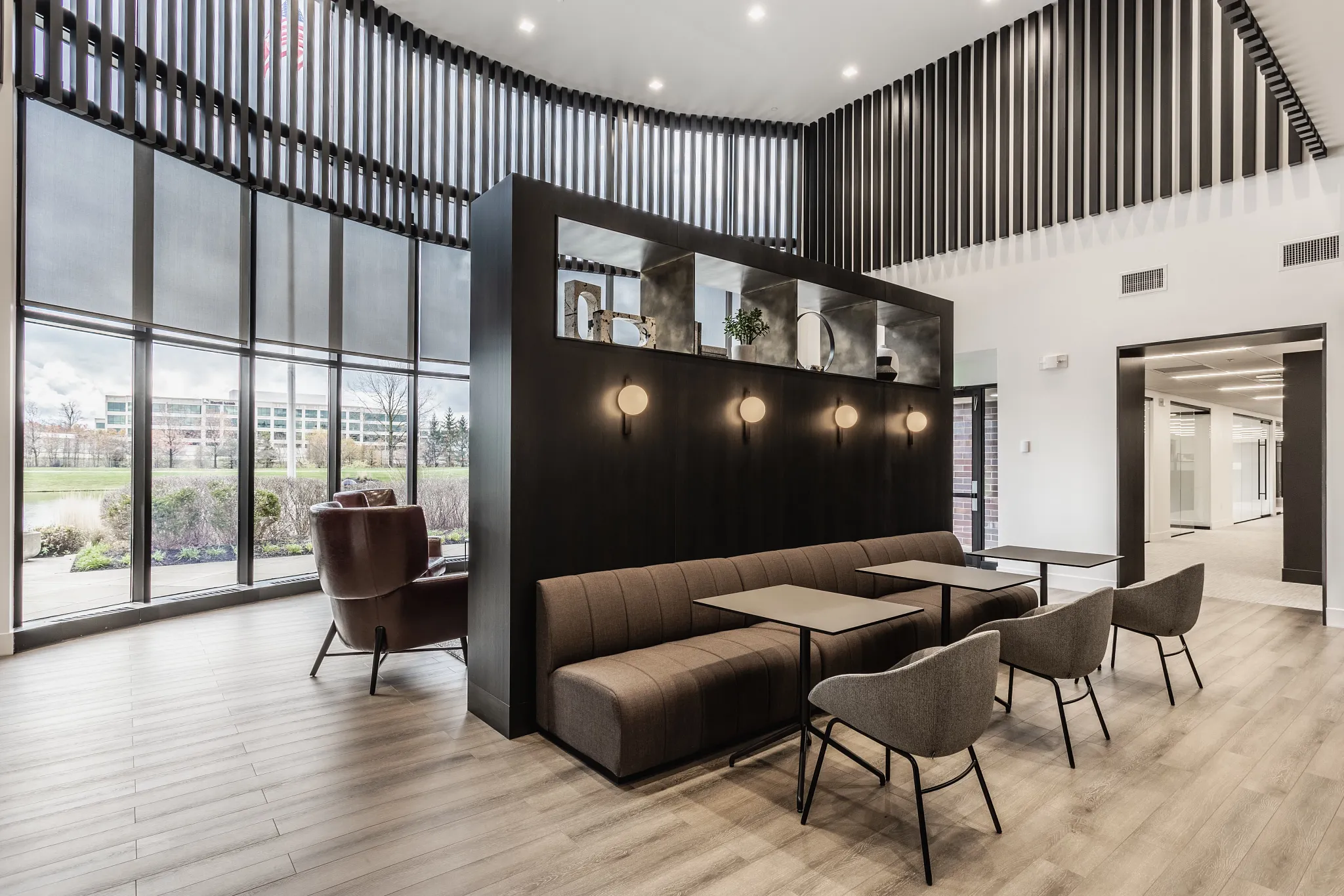 Modern seating area with Rigid Core flooring in a workplace setting