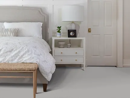 Stylish bedroom featuring soft surface flooring for comfort Cozy bedroom with soft surface flooring and elegant decor