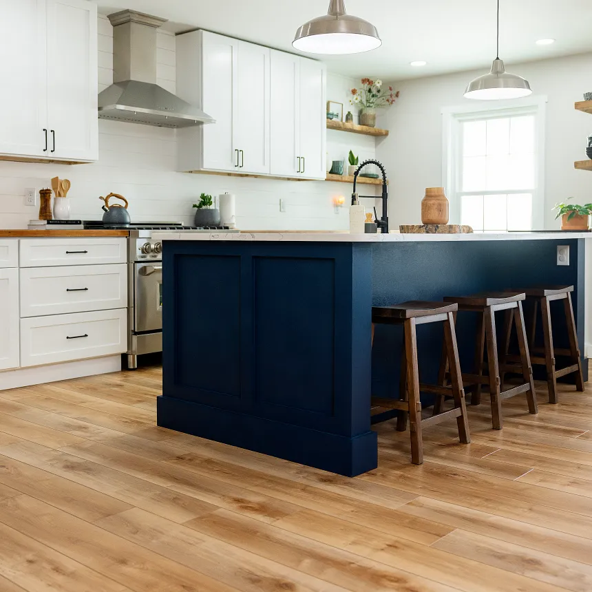 Coretec Residential WPC Luxury Vinyl Plank Flooring in Modern Kitchen - 48.03x7.09 inch kitchen with luxury vinyl plank floor in a wood look with a blue island and white cabinets