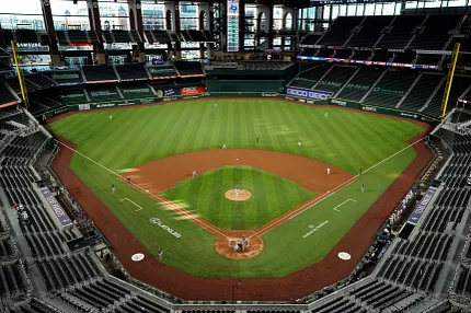 Baseball stadium with artificial turf field and empty stands Aerial view of a baseball stadium with artificial turf field and empty stands